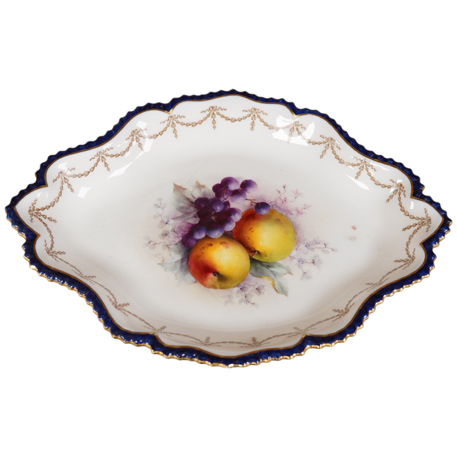 A Royal Worcester fruit painted oval dessert dish, signed Cole. 30.5cm wide. Condition - crack to base